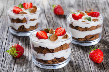 homemade yogurt in cups with whole grain flakes