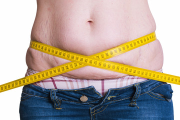 fat woman measuring her waist