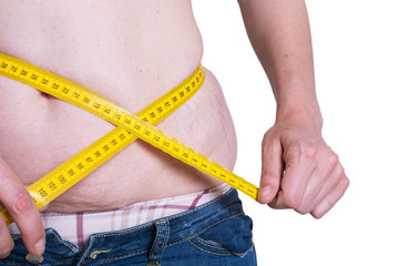 fat woman measuring her waist