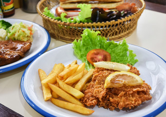 Fried fish and potato chips.Fish and chips served with lemon.