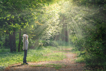 girl walking in the park,Sun rays