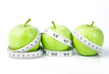 green apple with Measuring tape on white background 