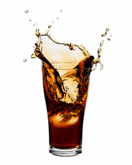 Cola splashing out of a glass., Isolated white background.