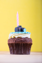 Delicious cupcake on table