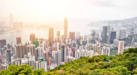 Business concept for real estate and corporate construction - panoramic modern city skyline bird eye aerial view with dramatic sunrise and morning blue sky in Hong Kong (HK), China - obrazy, fototapety, plakaty