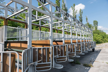 The gate for horse races empty on a spring afternoon