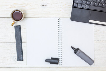 cup coffee and notepad on white boards