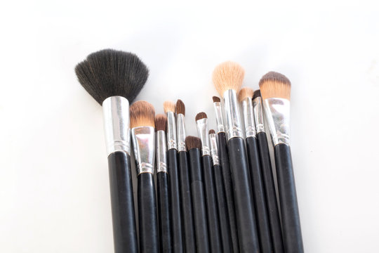  makeup brush to used on  white background,selective focus