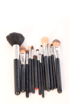  makeup brush to used on  white background,selective focus