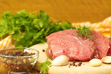 Raw meat with spices and vegetables ready for cooking