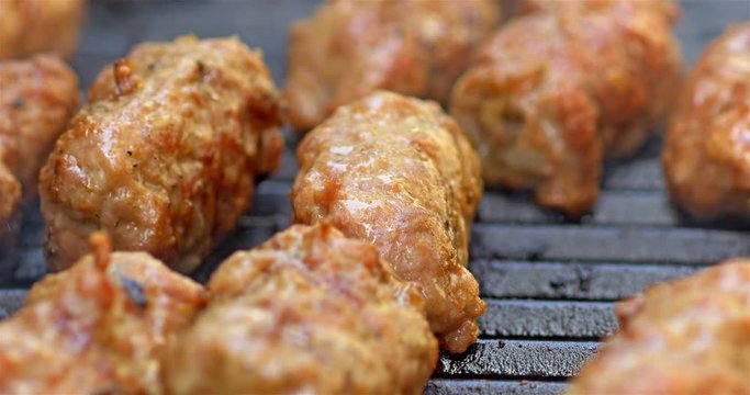 Preparing Traditional Romanian Barbecue With Pork Meat Rolls And Stakes