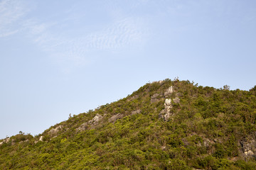 mountainside with blue sky