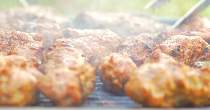 Preparing Traditional Romanian Barbecue With Pork Meat Rolls And Stakes