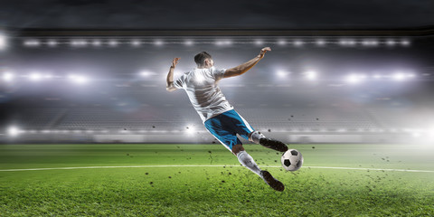 Soccer player hitting ball