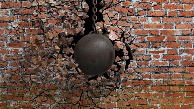 Metallic rusty wrecking ball on chain shattering an old brick wall. 3D rendering © viperagp