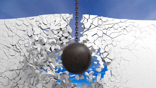 Metallic rusty wrecking ball breaking the wall, with blue sky. 3D rendering
