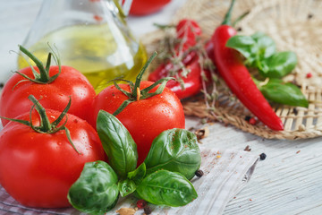 Italian food background, with tomatoes, basil, olive oil, pepper