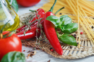 Italian food background, with  tomatoes, basil, spaghetti, olive