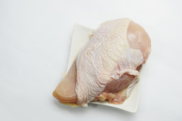 chicken for cooking on white plast
