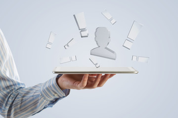 Tablet in hand with symbols