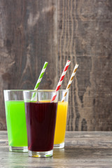 Fresh fruit smoothies on a rustic wooden background
