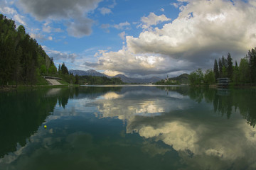 Fototapeta premium Clouds reflecting in the lake, Bled Slovenia