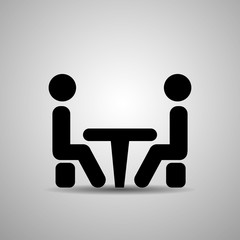 Icon Conference. People sitting around the table talking.