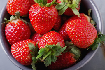 Strawberries and Blueberries on metal background