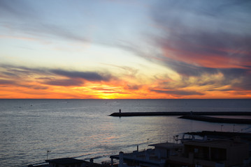 Fototapeta premium Dawn over the ocean, colorful sky background