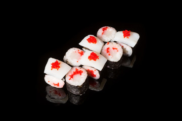 Japanese rolls on black background