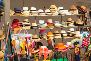 Street market selling hats and souvenirs in the touristic town