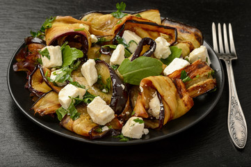 Appetizer - delicious salad with  grilled eggplants with feta cheese, parsley and rucola.