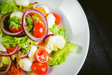 delicious vegetarian salad, salad with fruits and vegetables