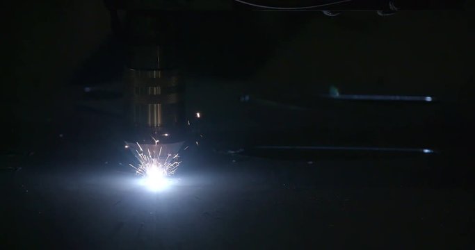 A plasma cutter cutting the big sheet inside the big steel factory