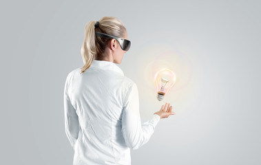 Woman in virtual reality glasses looking to the hologram, isolated. Shirt person stand back looking 3d cyber headset display. Wearable vr computer head set goggles watching. Man gaming glasses vision
