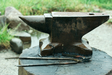 Old anvil and tongs