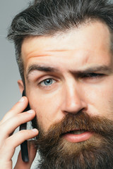 Bearded man with mobile phone