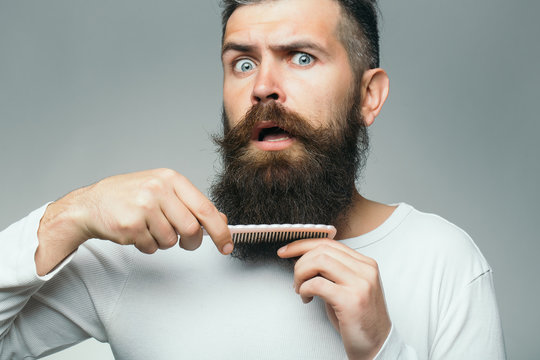 Bearded man with hair brush