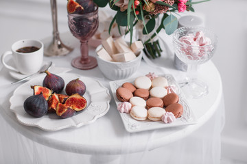Fototapeta na wymiar Breakfast Figs and sweets. White background. Macaroon. Wedding