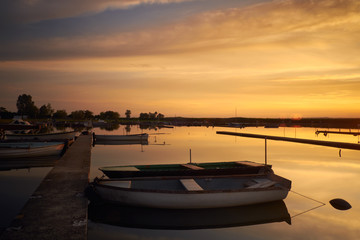 Fototapeta na wymiar Boats in the harbor at sunset