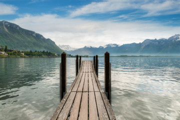 Switzerland landscape - Wooden pier in lake at Switzerland. Beau