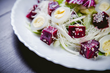 Buriak salad, greens and perepelin?h eggs, sesame