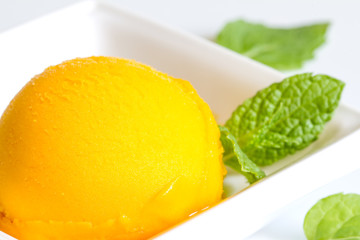 Mango sherbet with mint closeup
