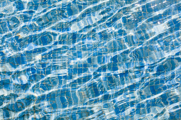 Sparkly swimming pool blue water surface
