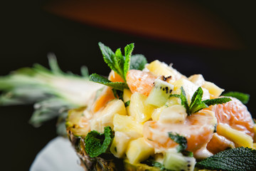 Dessert fruktov?y salad in a plate of pineapple