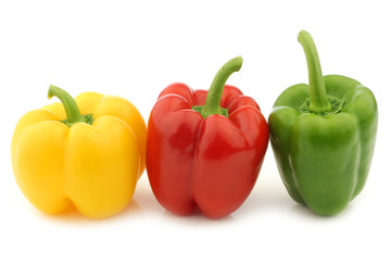 red, green and yellow pepper (capsicum) on a white background