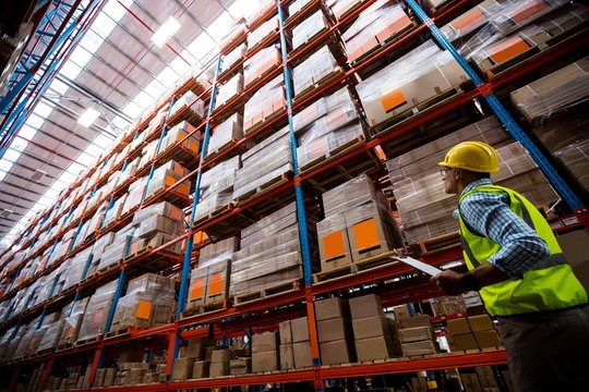 Warehouse worker walking in an aisle