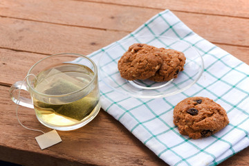 Cup glass of green tea and cookies