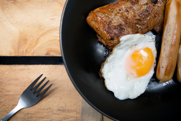 Homemade foods - Chicken fillet grilled steak and egg fried on wooden background