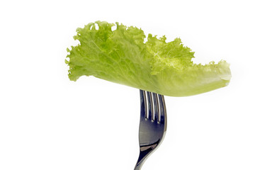 Lettuce leaf skewered in fork